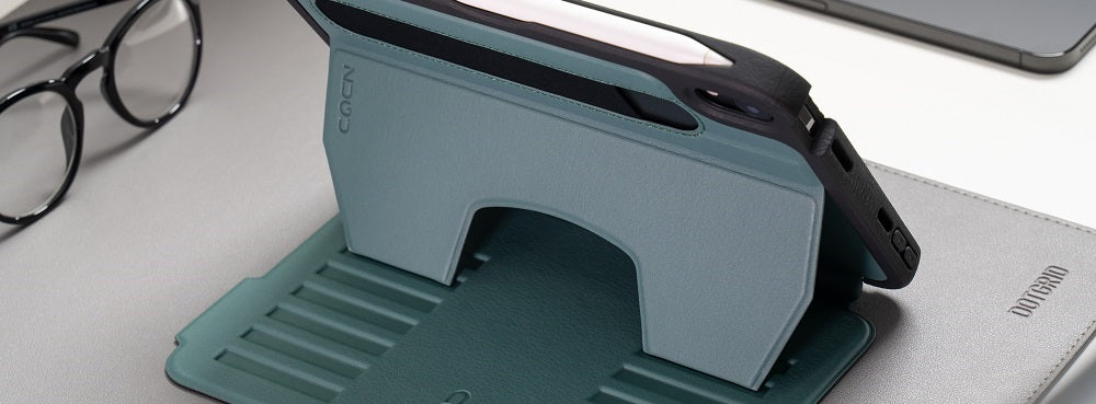 A green iPad case in a stand mode, featuring a built-in pencil holder