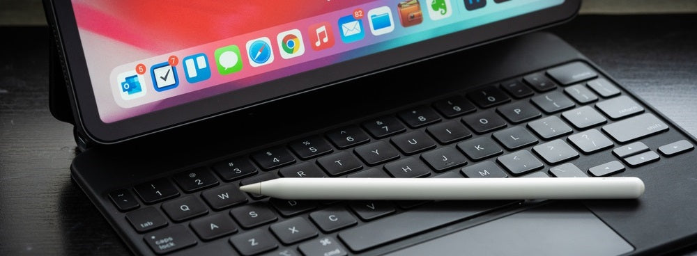 Close-up of a tablet with a stylus placed on a keyboard